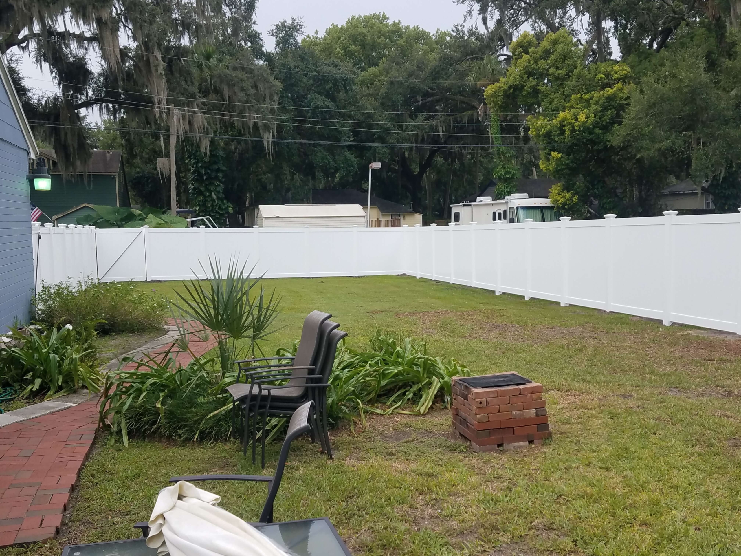 6' HIGH WHITE VINYL TONGUE & GROOVE PRIVACY vinyl fencing outside lawn