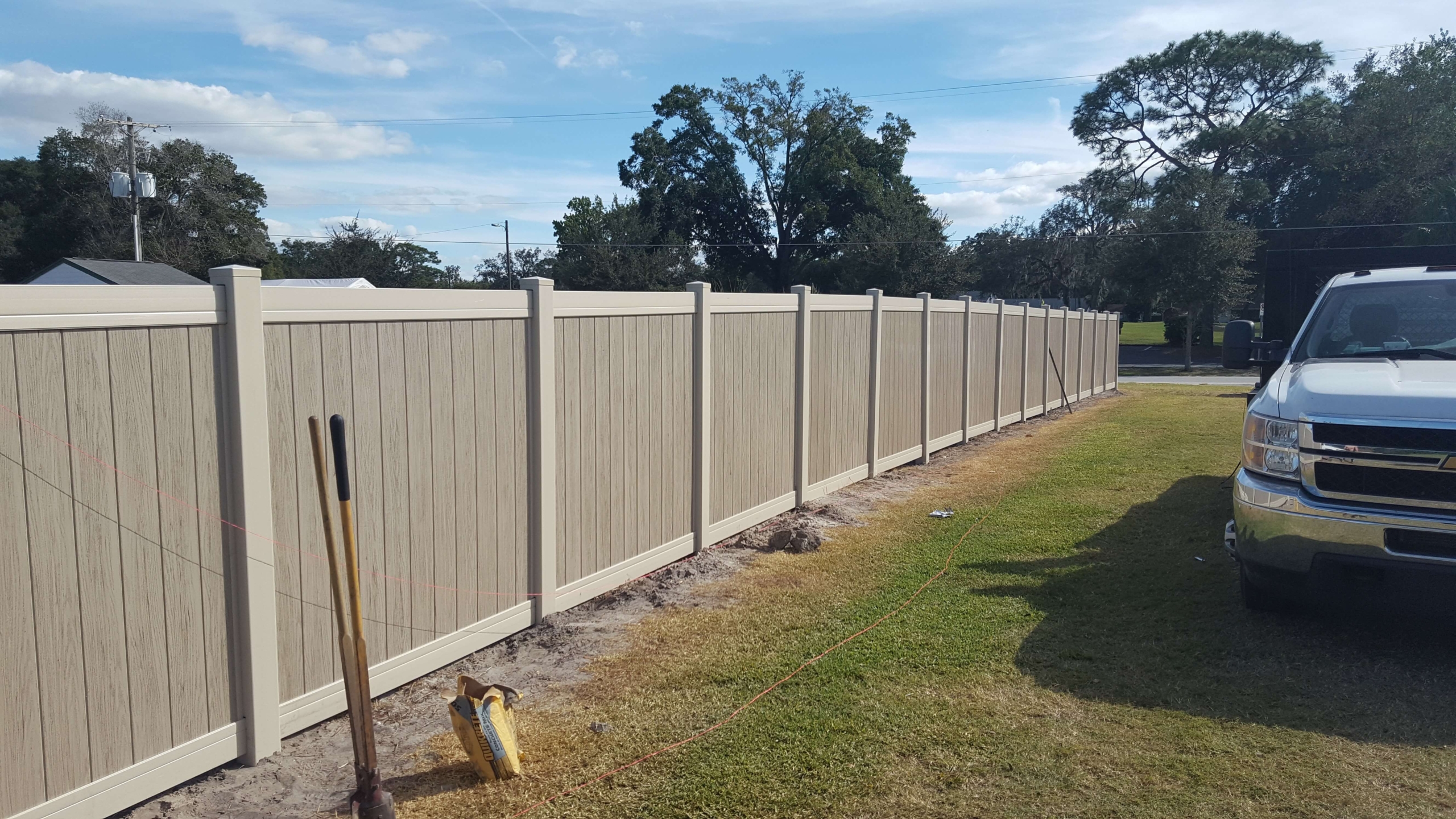 6' High Dark Khaki Multigrain Vinyl Privacy vinyl fencing in lawn