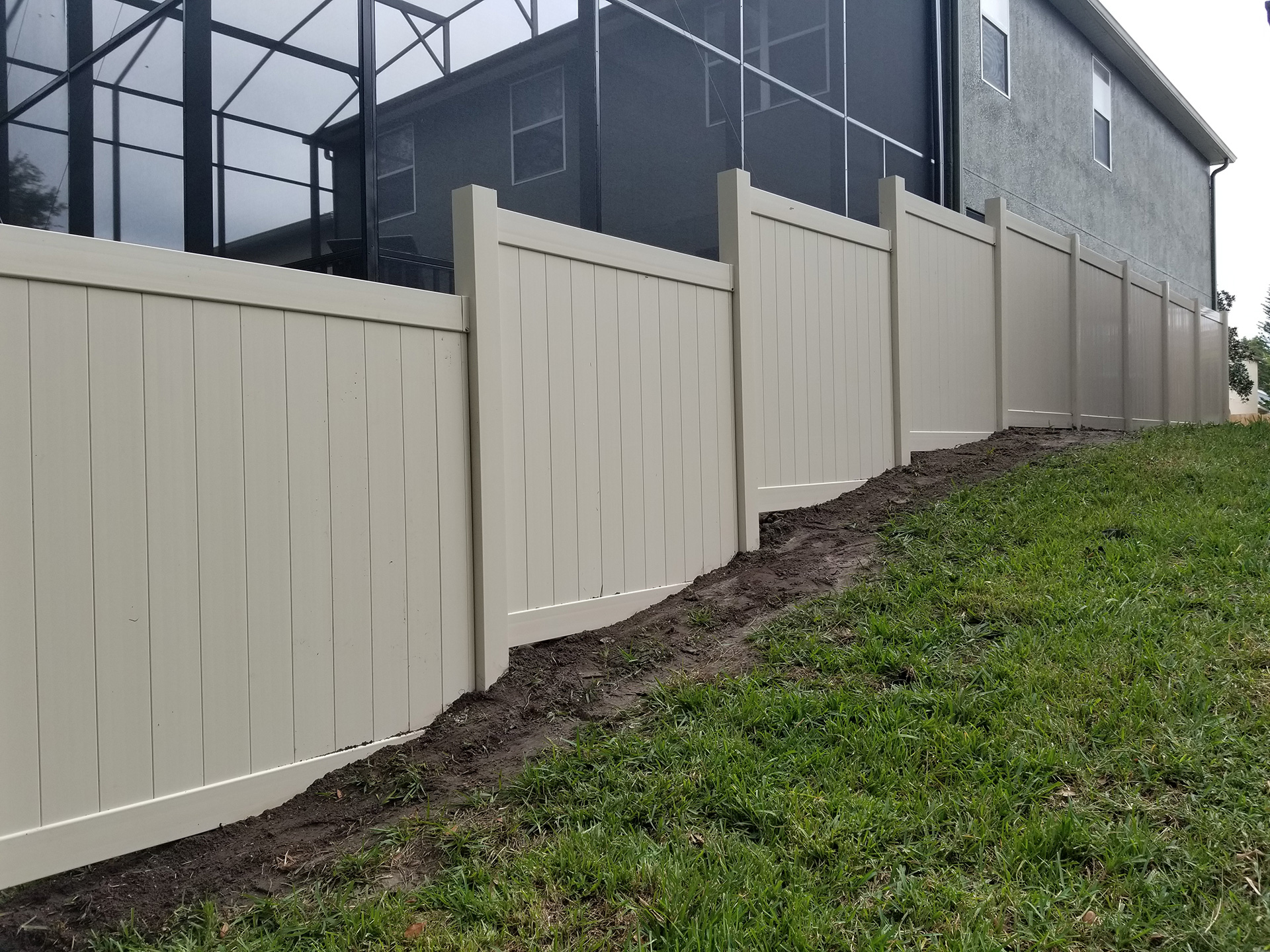 6'-HIGH-TAN-VINYL-T&G-PRIVACY- vinyl fencing outside house