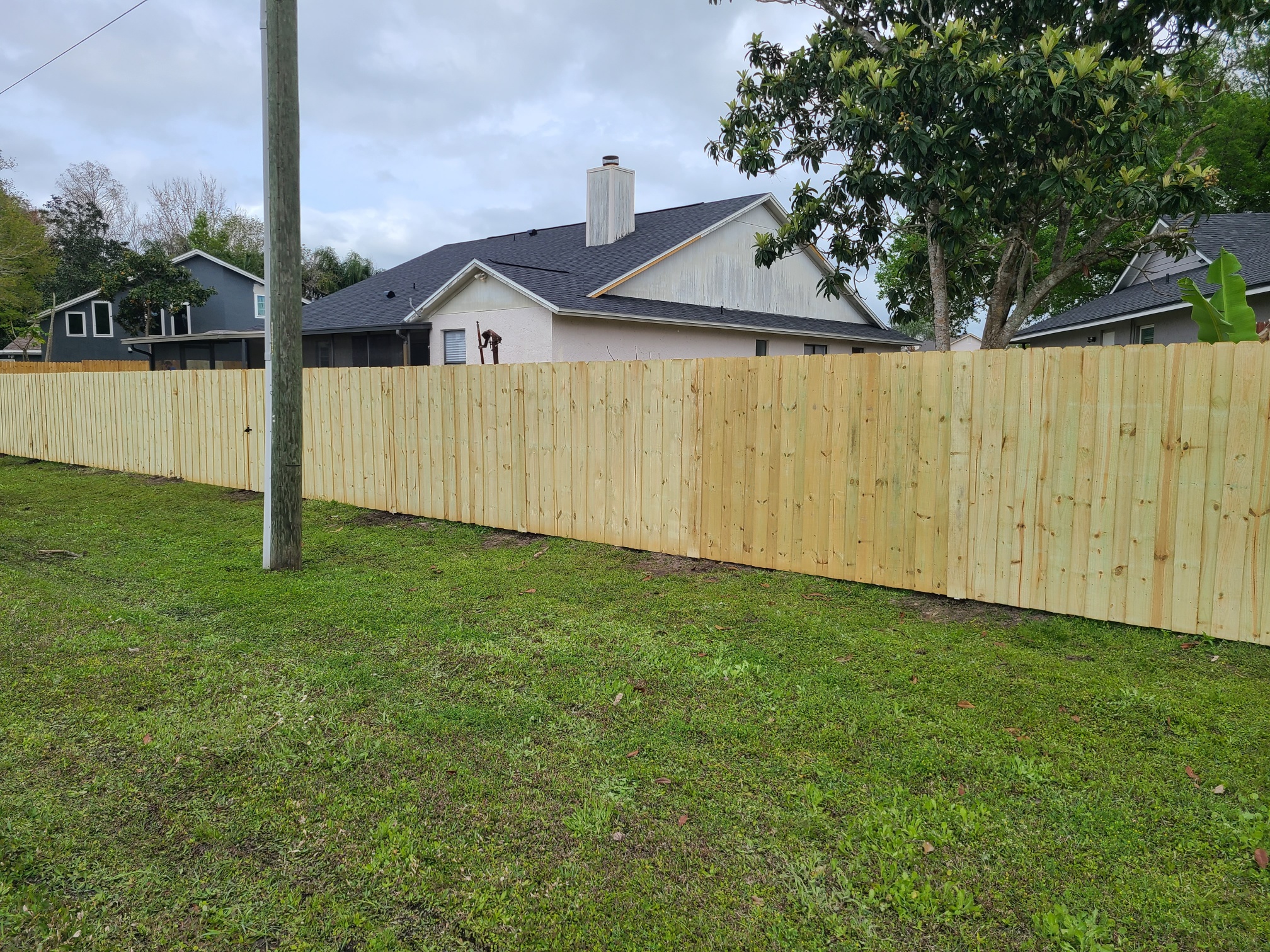 wooden fence in lawn