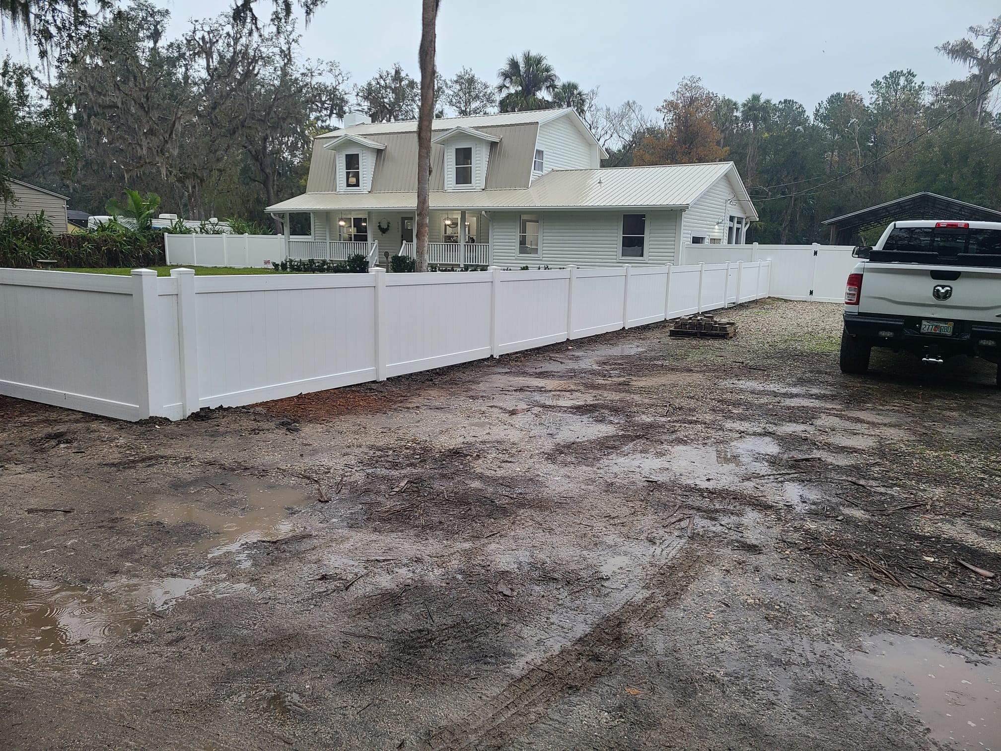 white vinyl fencing outside house